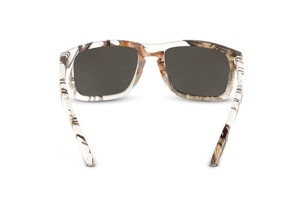 Decoy sunglasses in Mossy Oak Winter camo, in-hand view