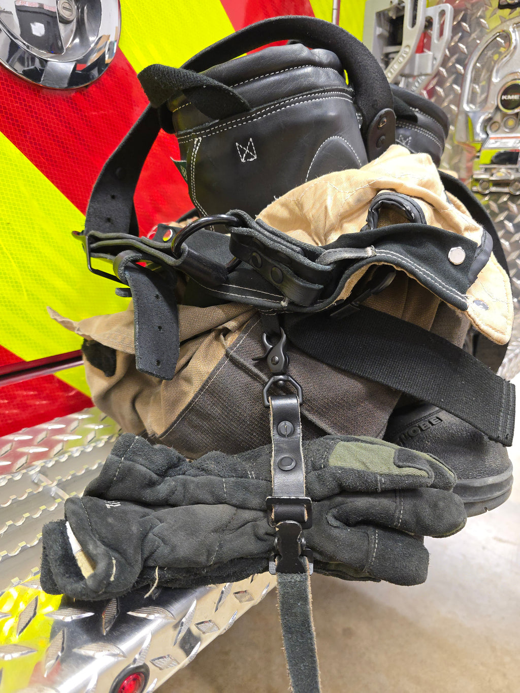 Leather firefighter glove strap, buckle detail