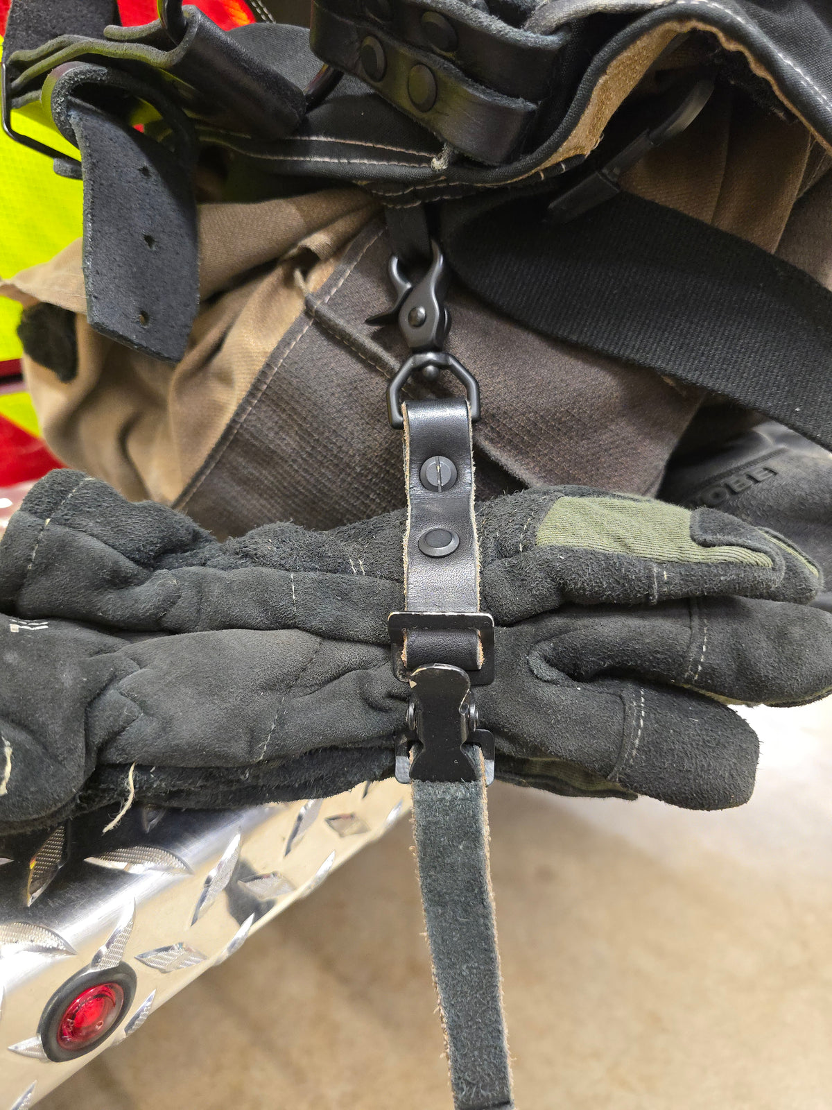 Leather firefighter glove strap, trigger snap detail