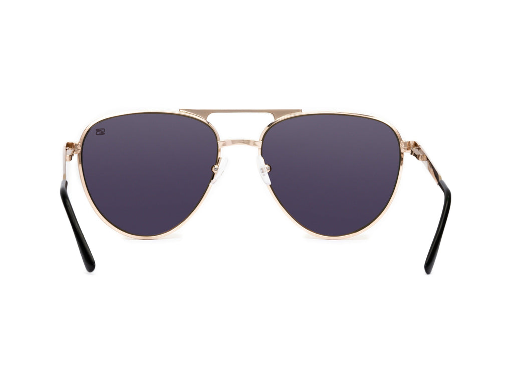 Aviator sunglasses in rose gold with pink lens, case and packaging